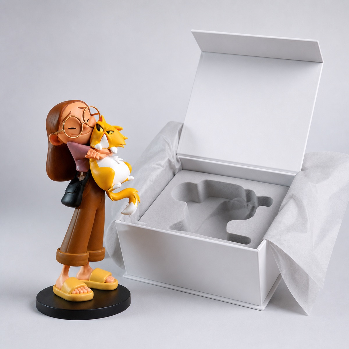 Custom figure beside premium gift packaging